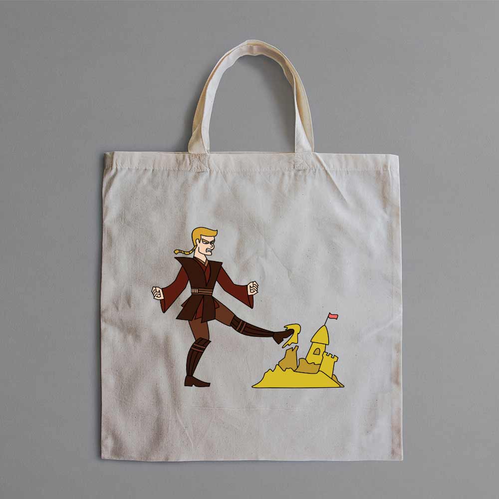 An image of a tote bag with the design of Anakin kicking a sand castle on the front.
